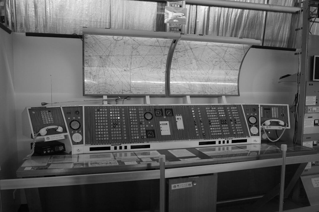 Wide view of a television regie control desk with multiple screens